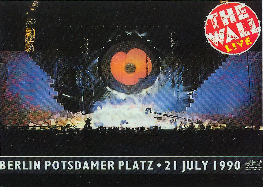 A giant poppy is surrounded by a large wall being constructed on Berlin's Potsdamer Platz for Roger Waters The Wall show