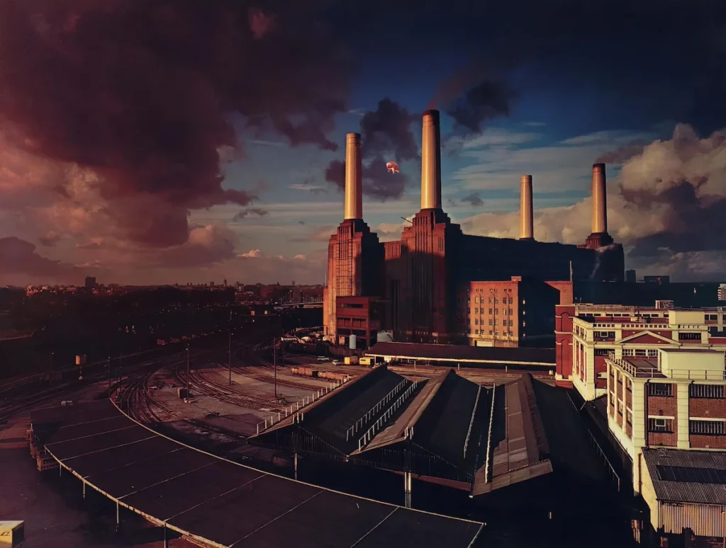 The iconic album cover of Animals showing a pig floating above Battersea Power Station