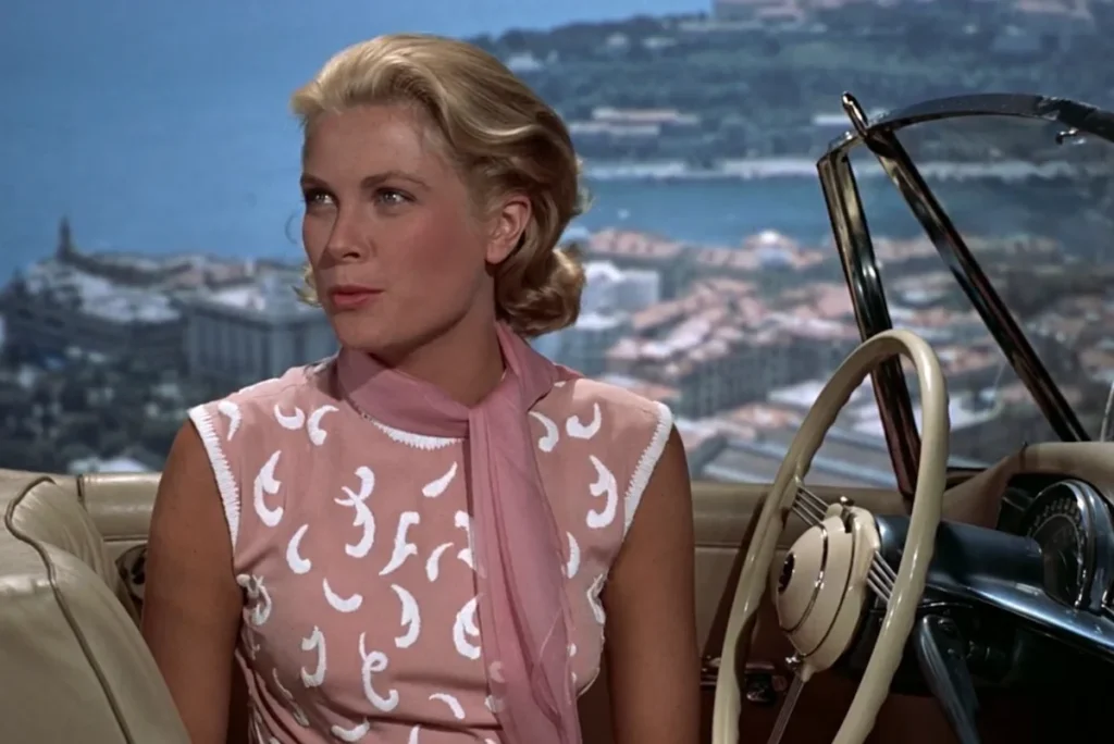 Grace Kelly sits in a car overlooking Monte Carlo in 'To Catch a Thief'
