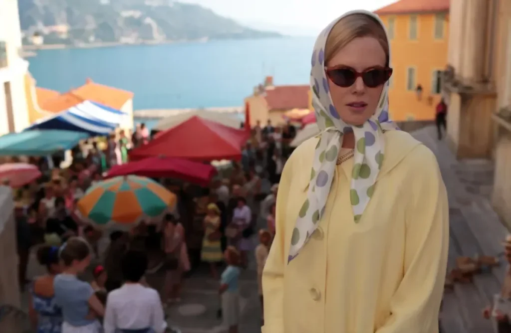 Nicole Kidman dressed as Grace Kelly above a marketplace in Monaco 
