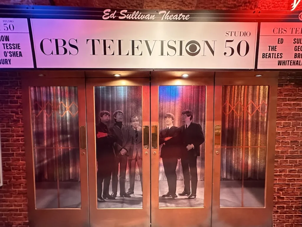 The entrance to CBS Television Studio 50. In the glass you can see the Beatles standing with their host Ed Sullivan
