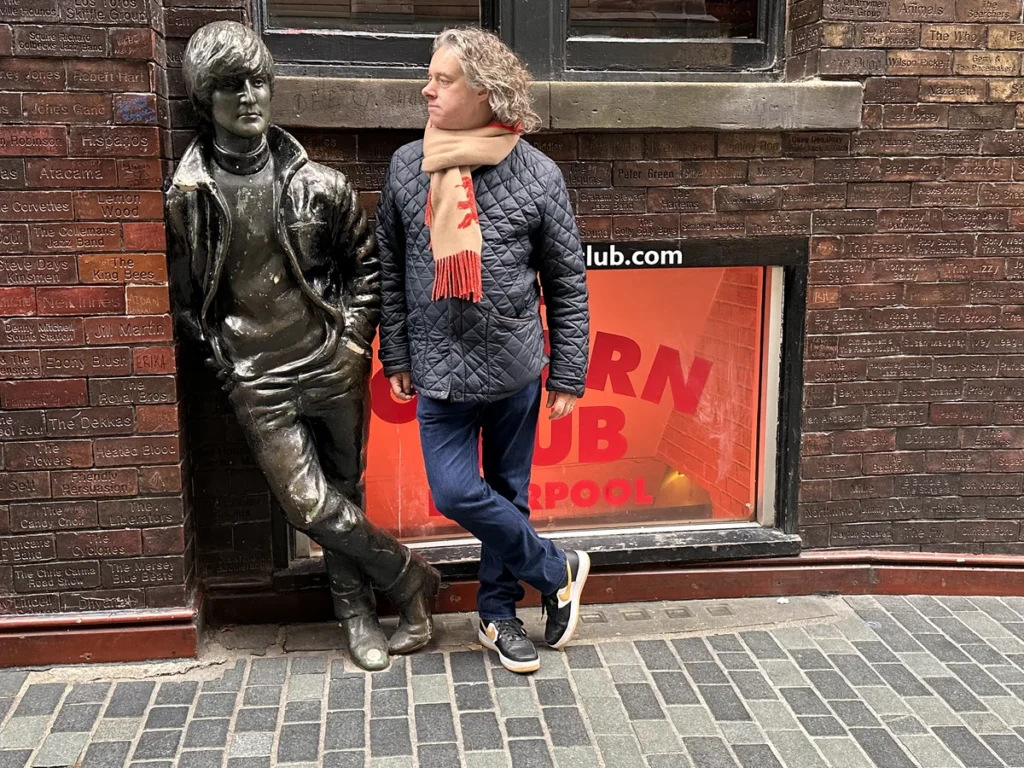 Jay stands next to the statue of John Lennon, opposite the Cavern Club in March 204