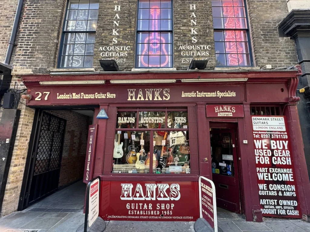The dark red shop front for Hanks Guitars on London's Denmark Street