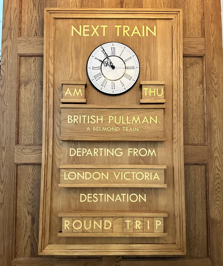 The Belmond Train departure board behind the concierge desk at the Cadogan Hotel