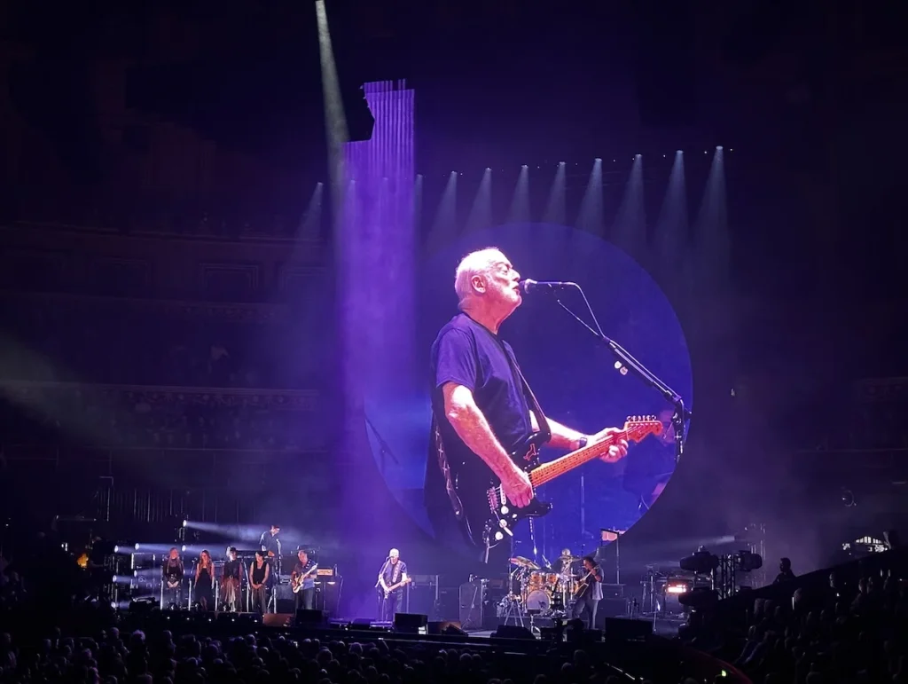 David Gilmour appears on the large circular screen above the band for his Luck and Strange concert at the Royal Albert Hall