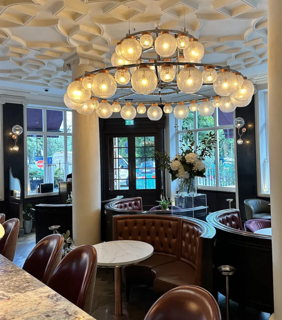 The bar at the Cadogan Hotel showing the bar in the front and the booth seating