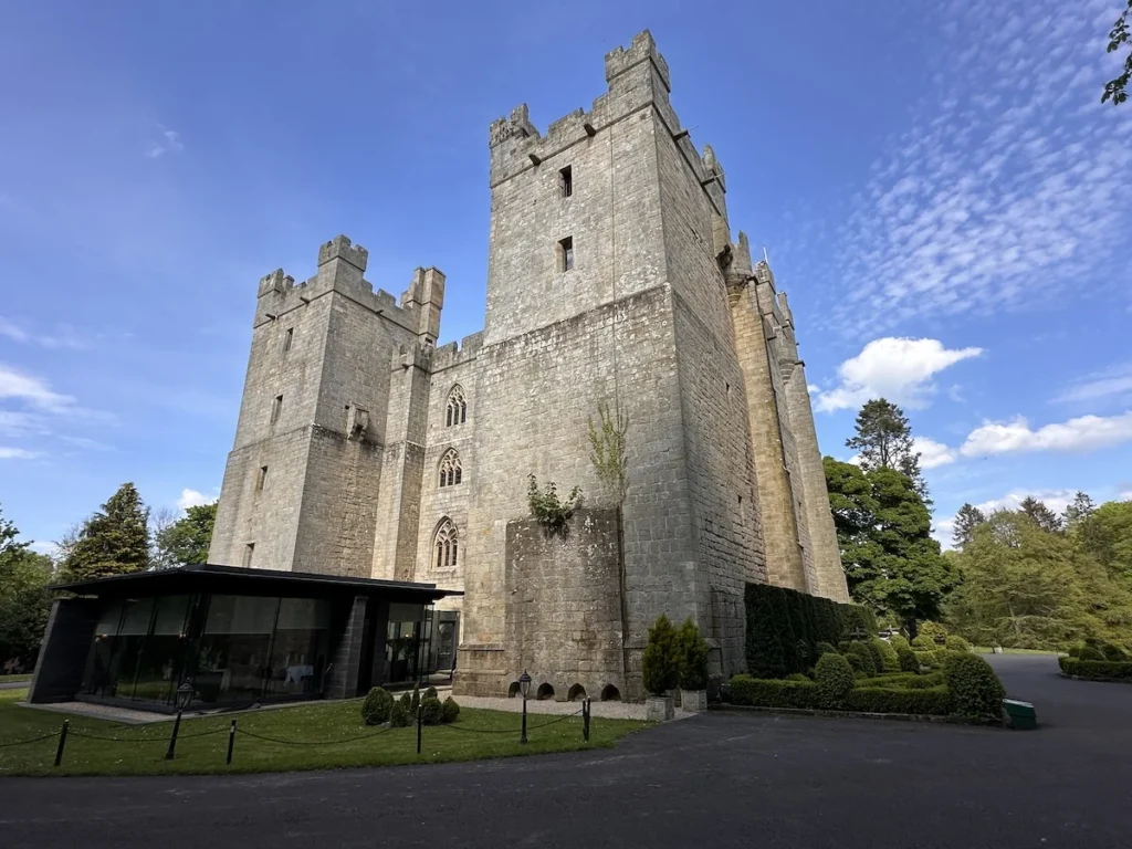 Langley Castle Hotel set against bright blue sy