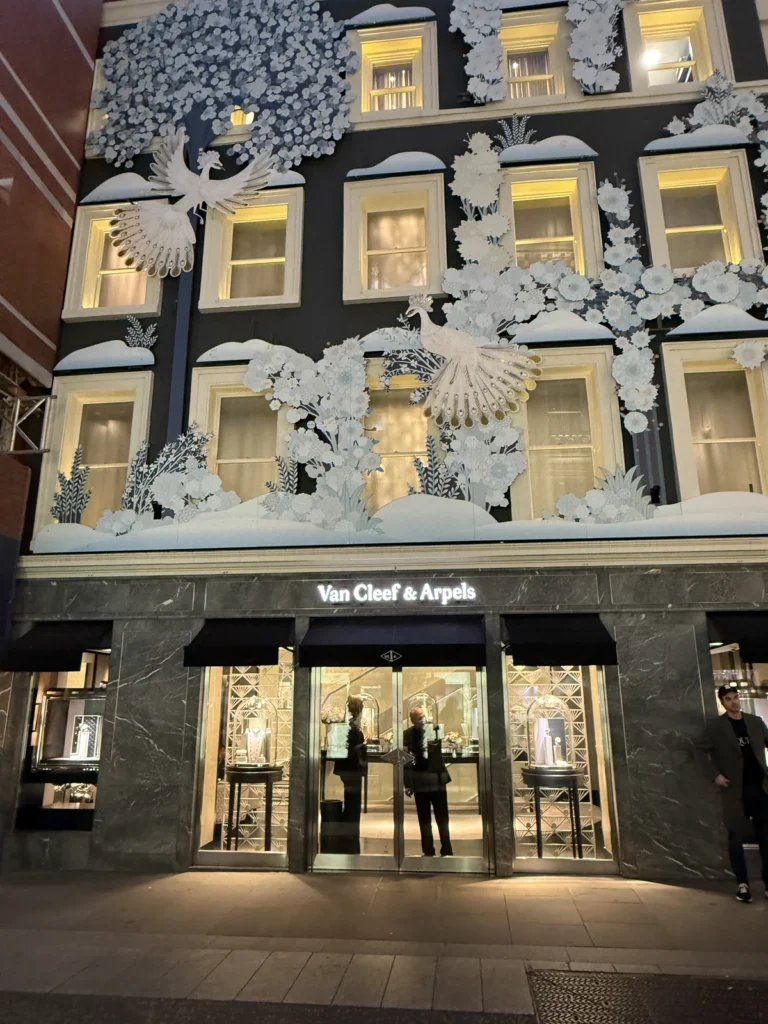 The Van Cleef & Arpels store decked in white peacocks, dressed for Christmas 2024 on Bond Street