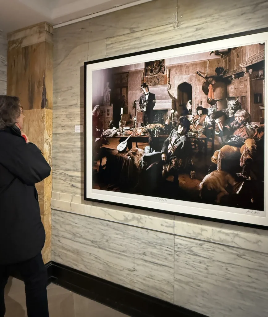 The author looking at a large print of the Beggars Banquet Photo on a grey wall