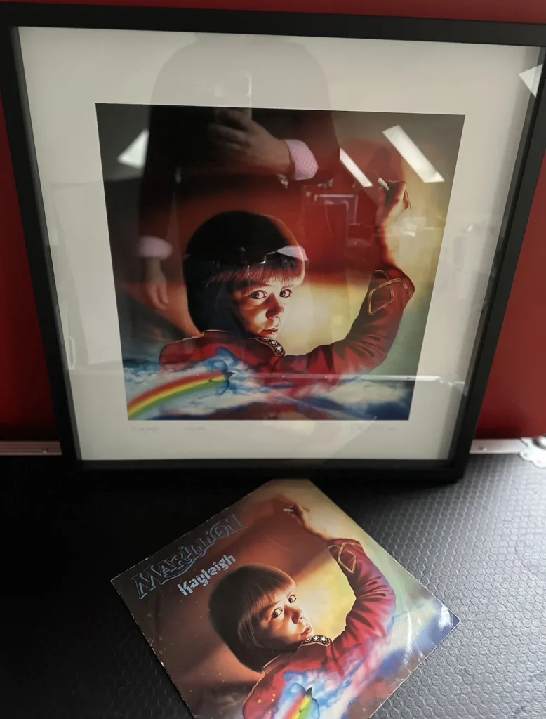 A rock art print of Marillion's Kayleigh cover, propped above the original 12" cover of the song