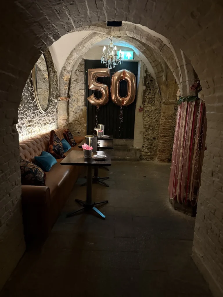 Golden Balloons spell out the number 50 as the Abbey vaults are set up for a party 