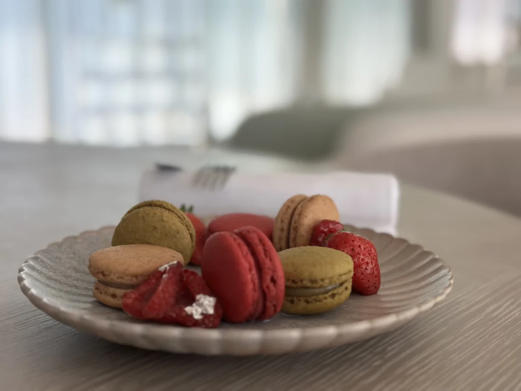 A delicate plate of red and coffee coloured Macarons, at the Chèvre D'Or. 