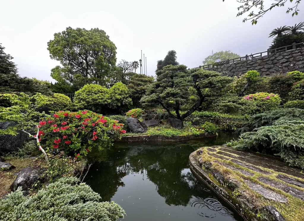 Lush greenery and a pond in Glover Garden, Nagasaki ©Wine, Travel & Song