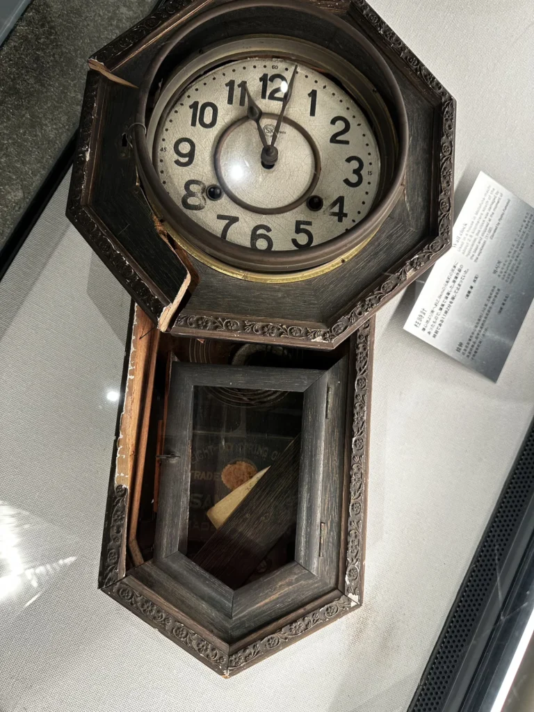 A broken clock from the Nagasaki Atomic Bomb Museum, stopped at 11:02 AM, the moment of the explosion ©Wine, Travel & Song