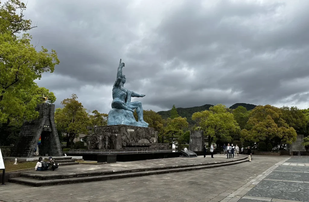12. The Peace Statue at Nagasaki Peace Park, with one hand raised to the sky and the other extended in peace ©Wine, Travel & Song